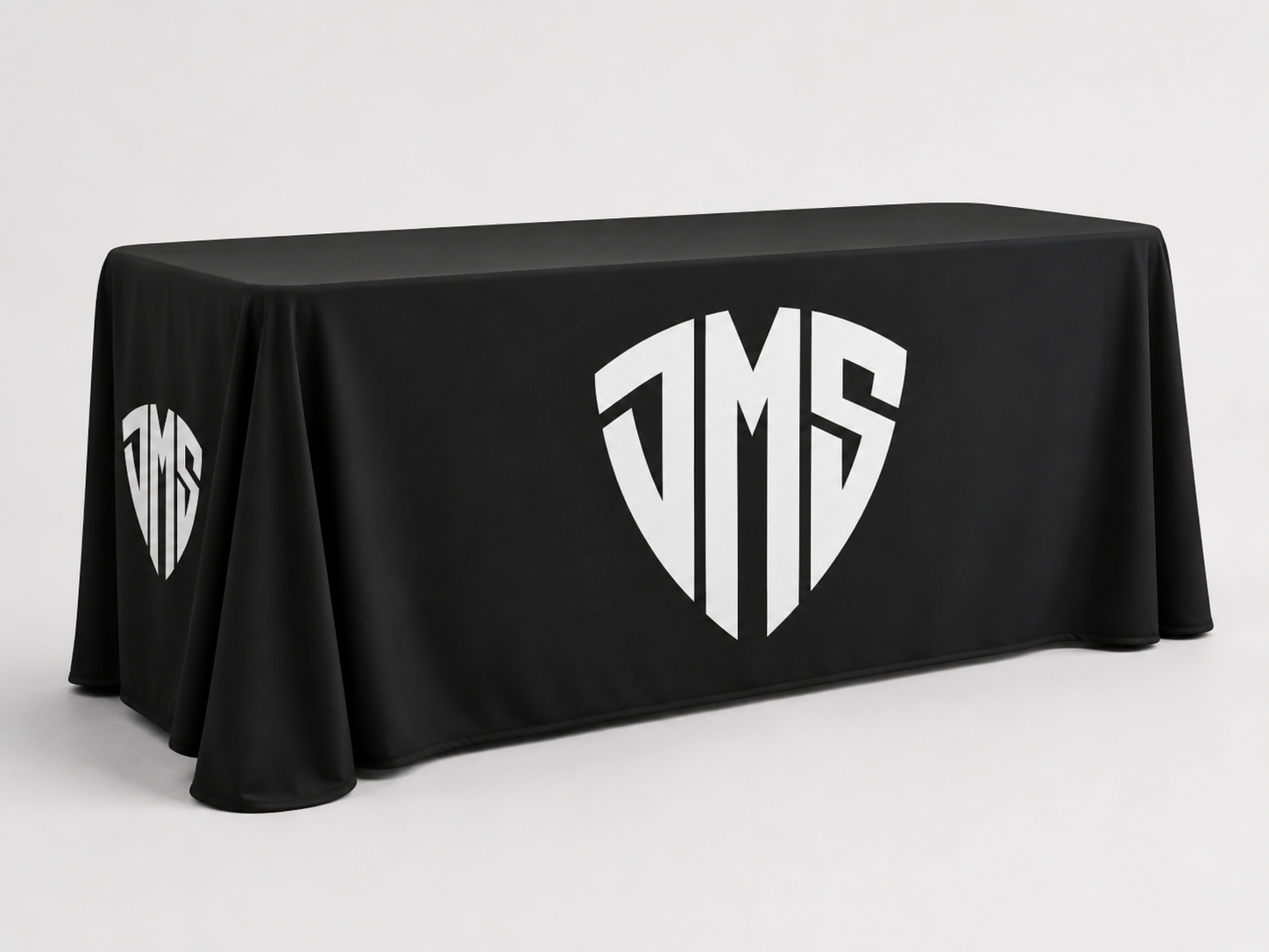 Custom printed dye-sublimated table throw on a 6ft table — DMS Studios